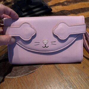 Betsy Johnson purse.  Complete with wallet features for cards and money.